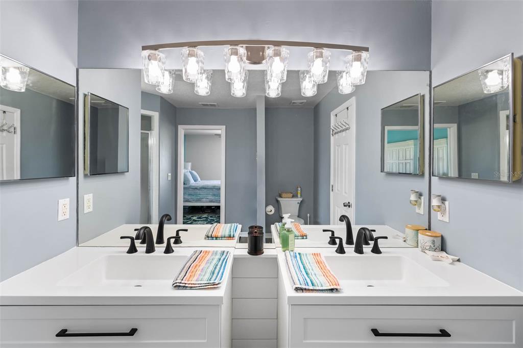 4464 Neptune Drive Hernando Beach, FL 34607 - Photo 20 of 47 a bathroom with a sink and a mirror