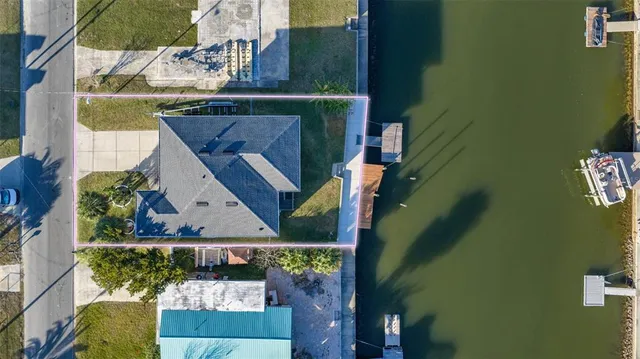 a kitchen with a sink a counter top space stainless steel appliances and cabinets