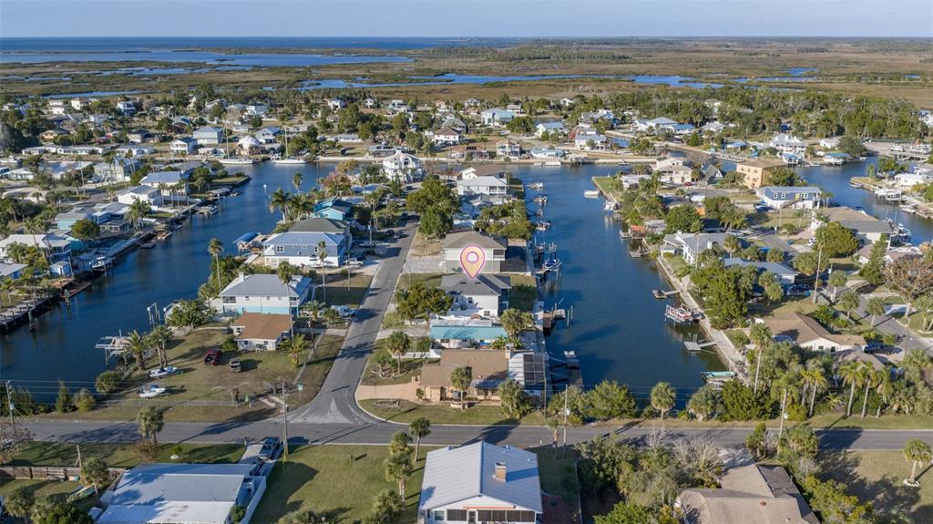 4464 Neptune Drive Hernando Beach, FL 34607 - Photo 41 of 47 an aerial view of residential building and lake