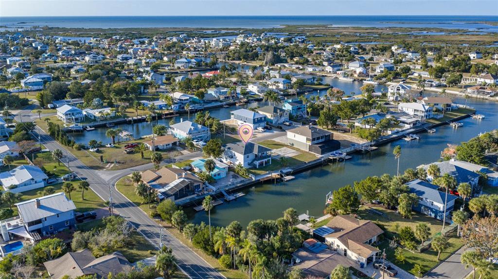 4464 Neptune Drive Hernando Beach, FL 34607 - Photo 42 of 47 an aerial view of residential houses with outdoor space