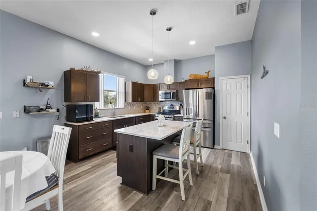 a bedroom with a large bed and a dresser