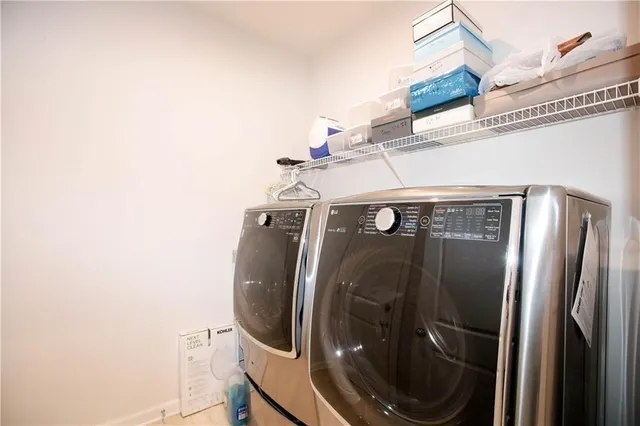 a view of a room with a table and chairs