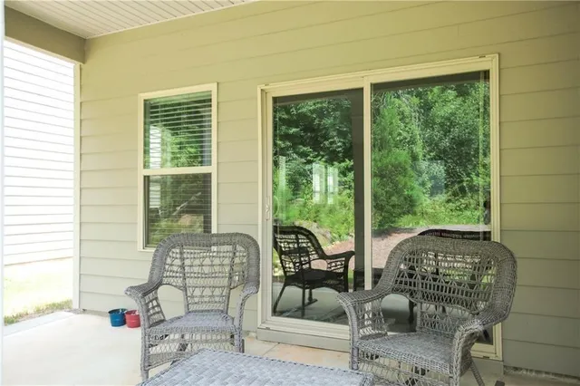 a balcony with furniture and garden
