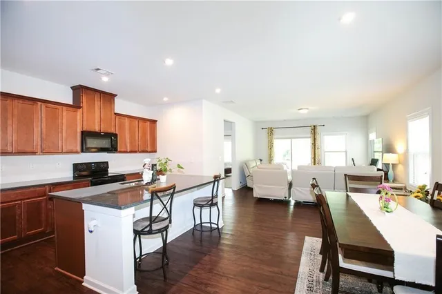 a view of a dining room with furniture and wooden floor