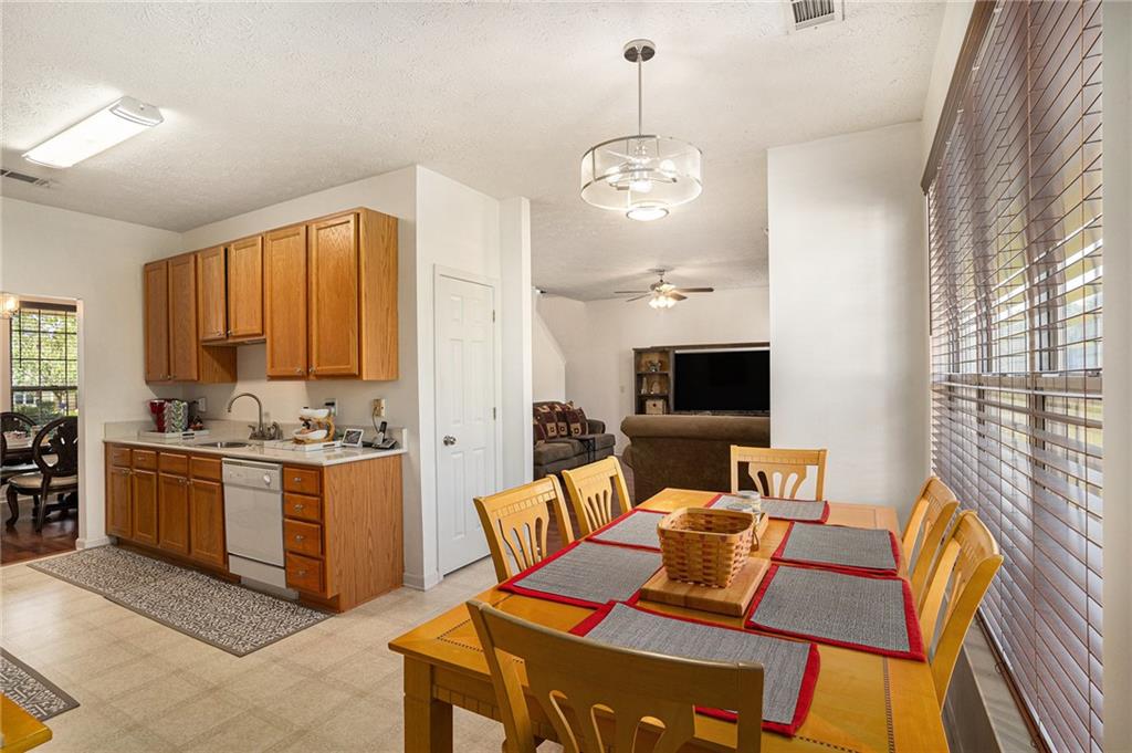 10897 Paladin Drive Hampton, GA 30228 - Photo 11 of 32 a living room with furniture kitchen view and a wooden floor
