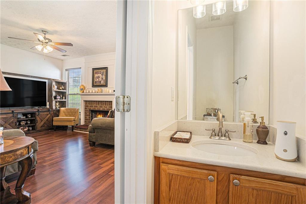 10897 Paladin Drive Hampton, GA 30228 - Photo 16 of 32 a living room with furniture fireplace and flat screen tv