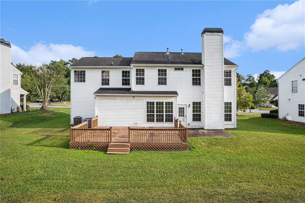 10897 Paladin Drive Hampton, GA 30228 - Photo 31 of 32 a view of a house with a yard and sitting area