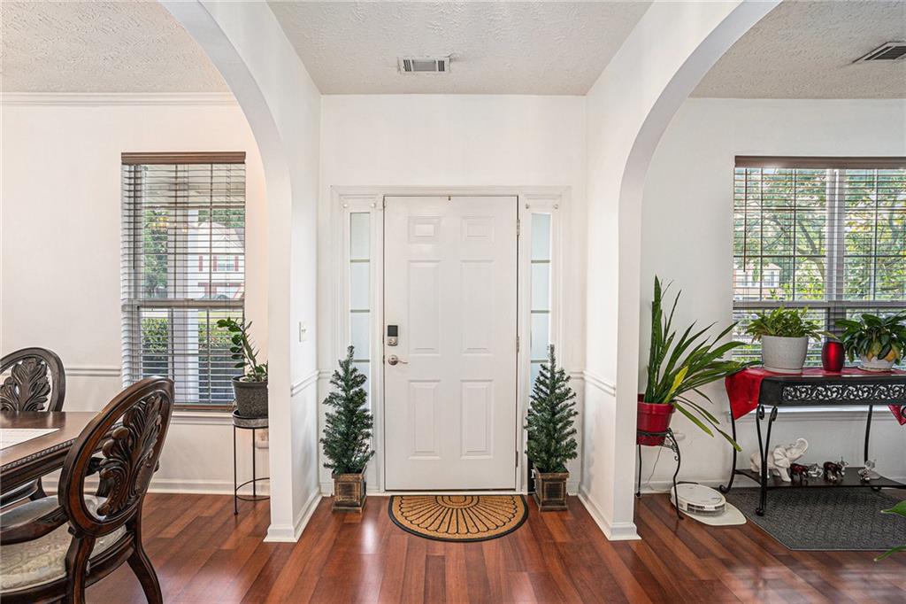 10897 Paladin Drive Hampton, GA 30228 - Photo 5 of 32 a view of a dining room with furniture window and wooden floor