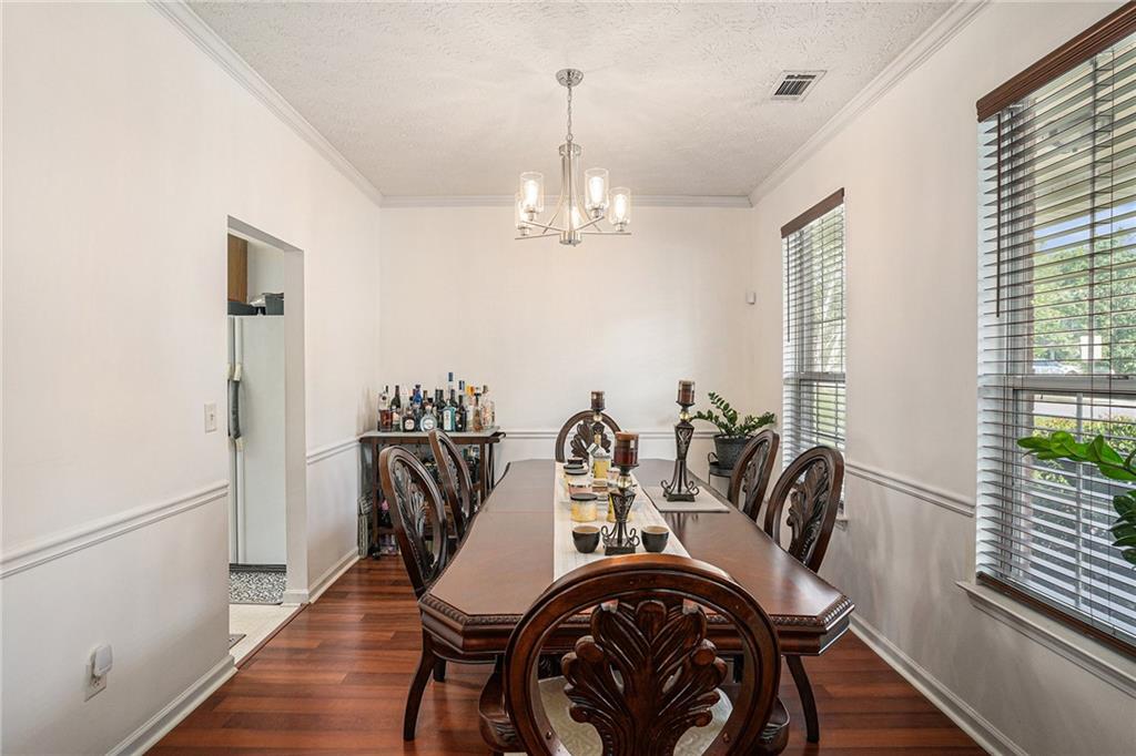 10897 Paladin Drive Hampton, GA 30228 - Photo 7 of 32 a view of a dining room with furniture window and wooden floor