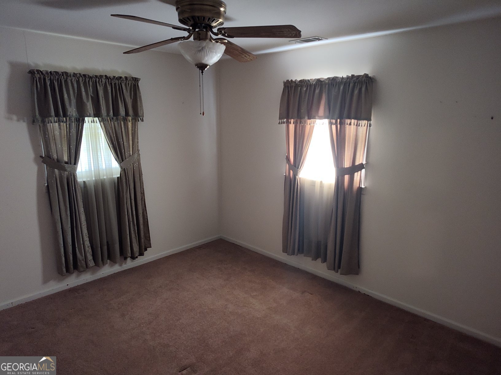 2289 Dr George Ward Road Elberton, GA 30635 - Photo 13 of 13 an empty room with a ceiling fan and window