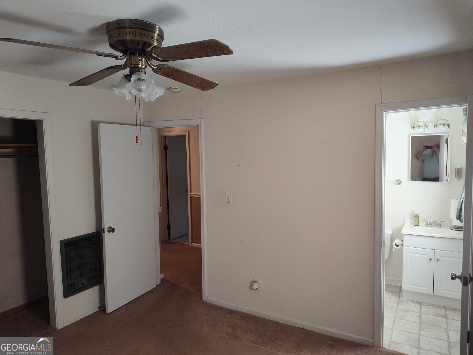 2289 Dr George Ward Road Elberton, GA 30635 - Photo 9 of 13 a view of a hallway with a chandelier fan and kitchen view