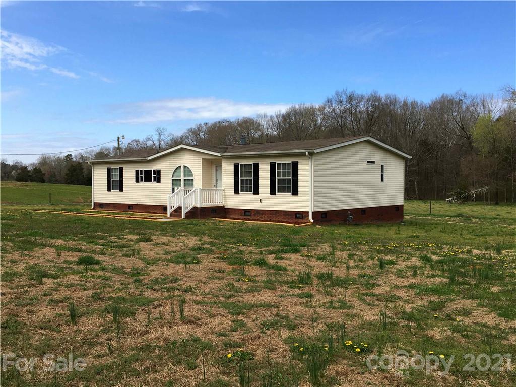 3853 State Rd S-29-330 Lancaster, SC 29720 - Photo 3 of 39 a view of a house with a yard