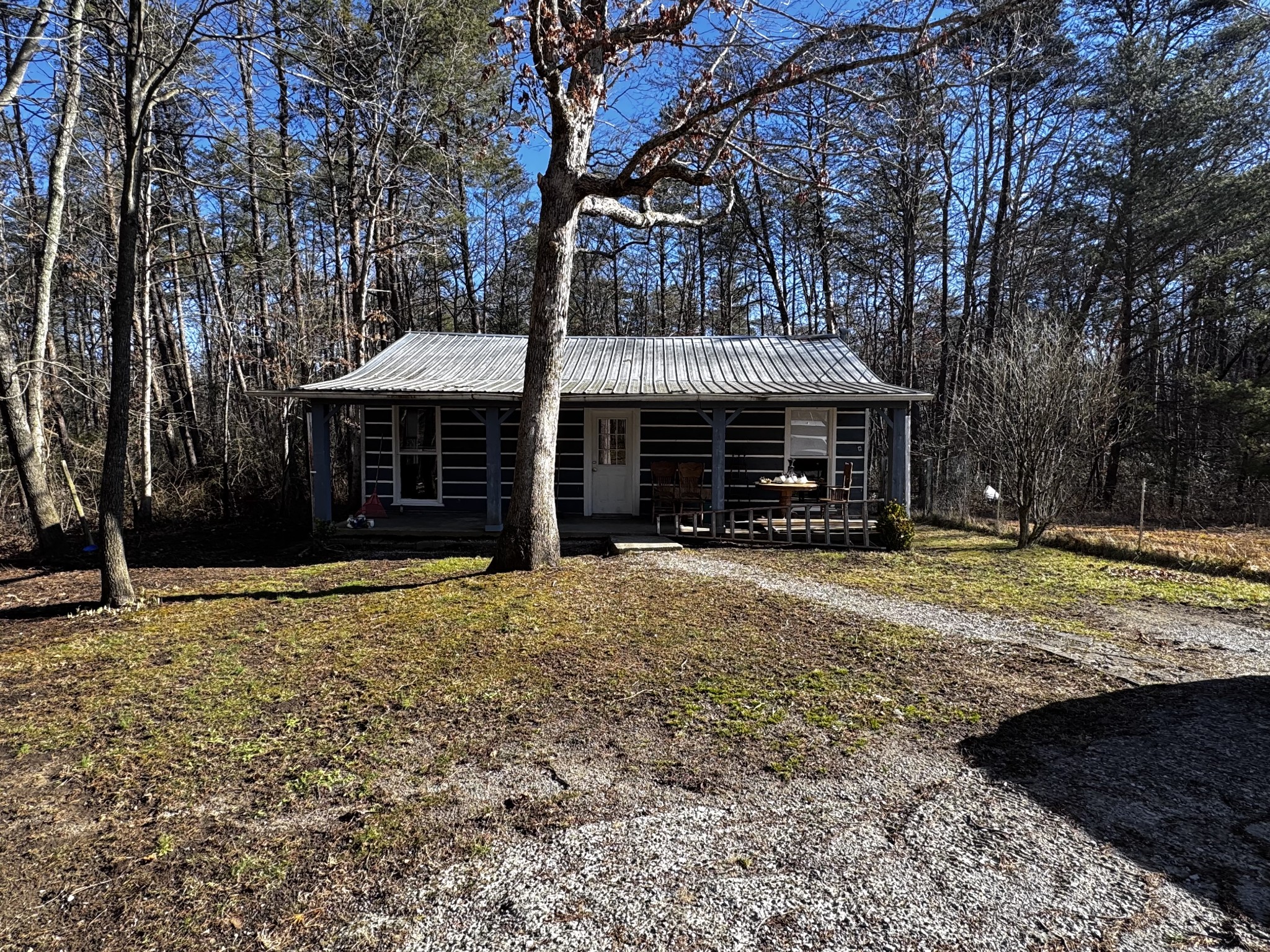 829 Highway 399 Palmer, TN 37365 - Photo 2 of 18 a front view of a house with a yard
