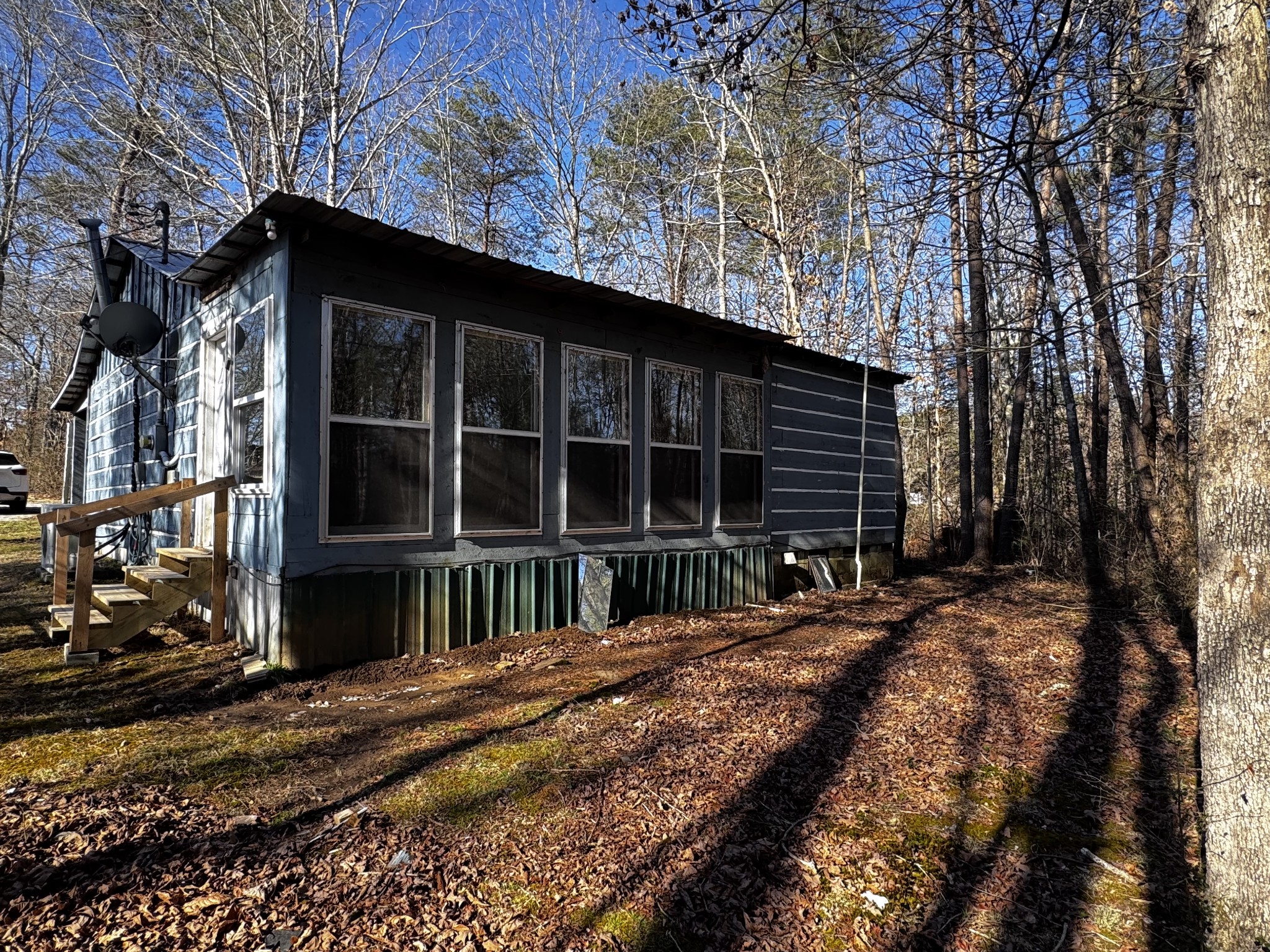 829 Highway 399 Palmer, TN 37365 - Photo 7 of 18 a front view of a house with a yard