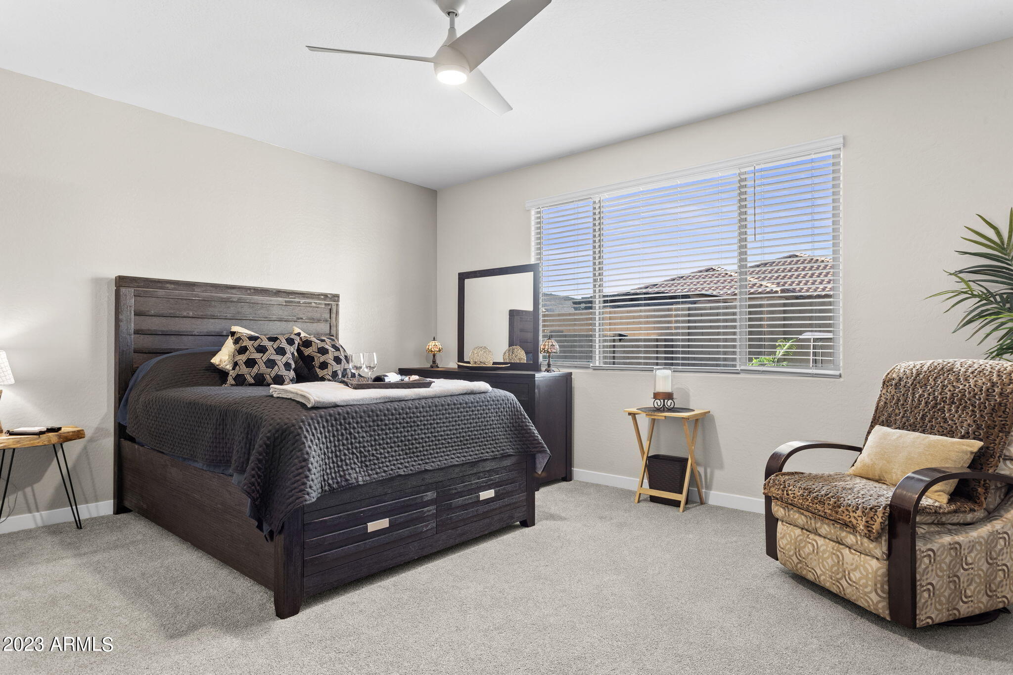 12356 East Soloman Road Gold Canyon, AZ 85118 - Photo 18 of 53 a bedroom with a bed and a couch next to a window
