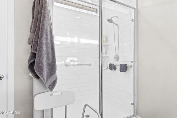 a bathroom with mirror and sink