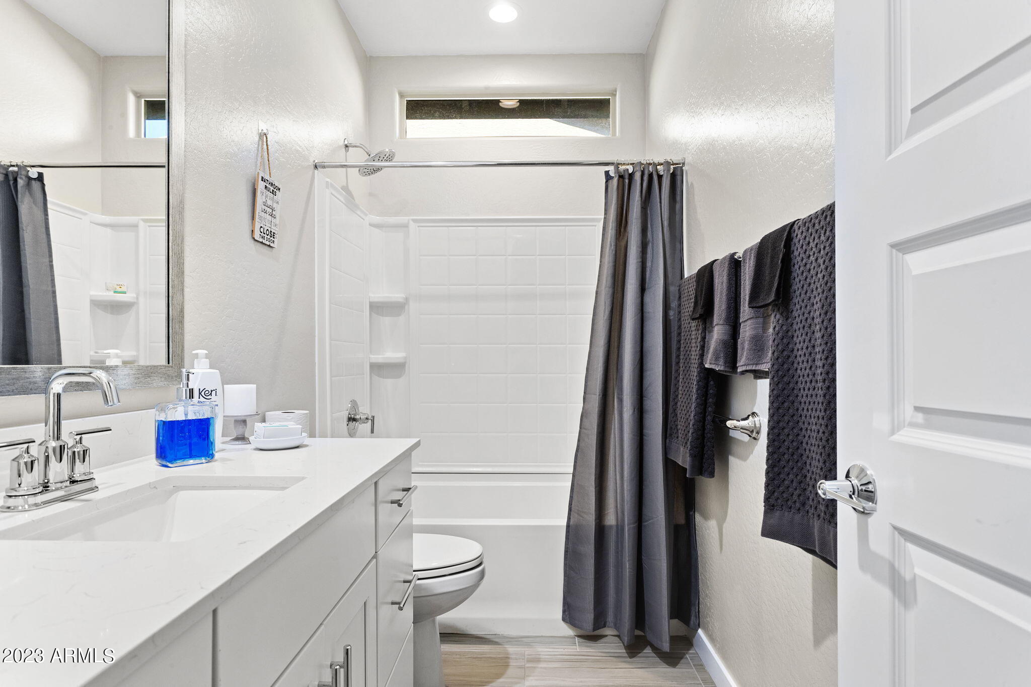 12356 East Soloman Road Gold Canyon, AZ 85118 - Photo 39 of 53 a bathroom with a sink a toilet a mirror and shower