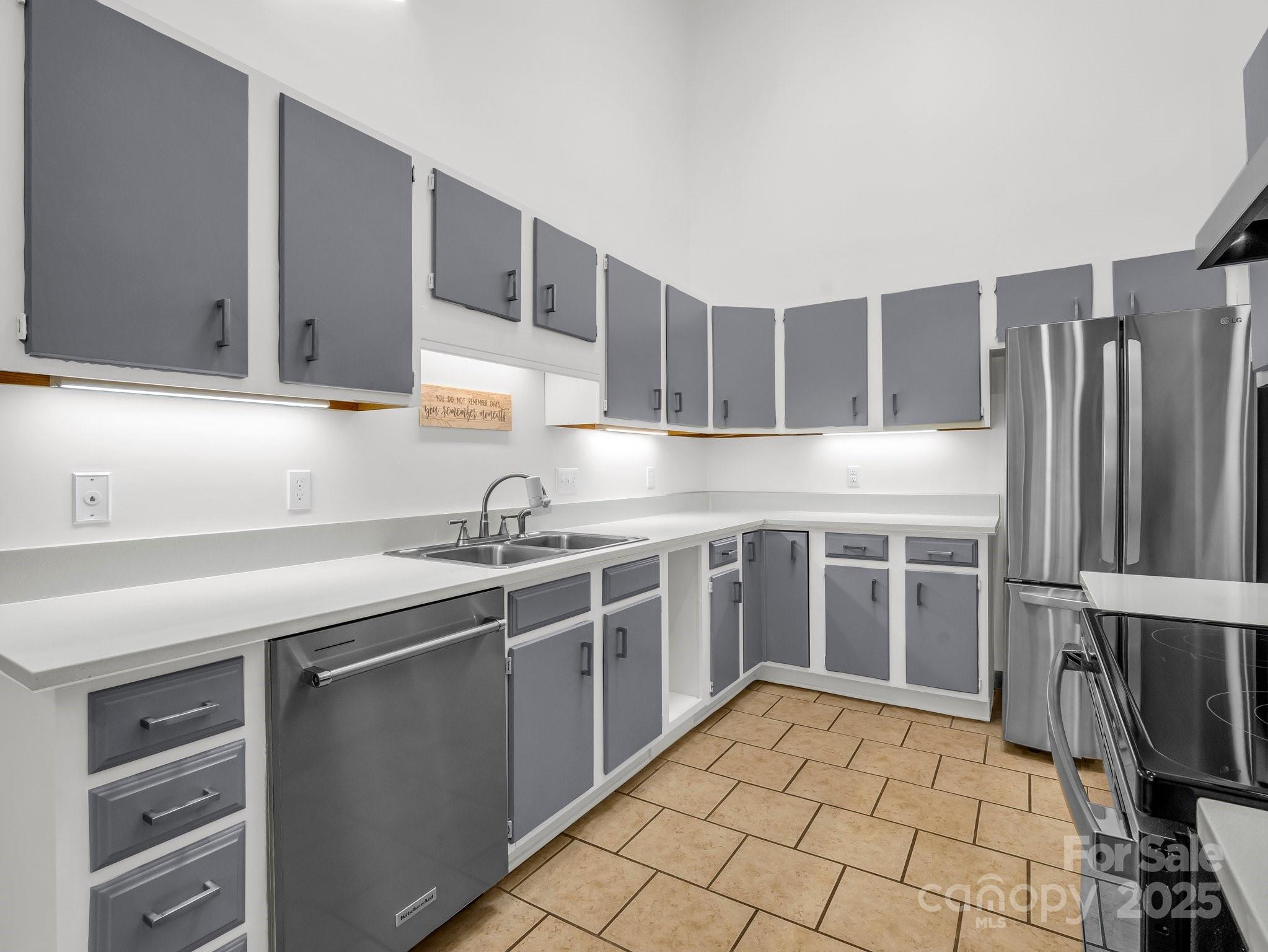 8 Hunting Country Trail Tryon, NC 28782 - Photo 12 of 37 a kitchen with stainless steel appliances granite countertop a sink stove and cabinets
