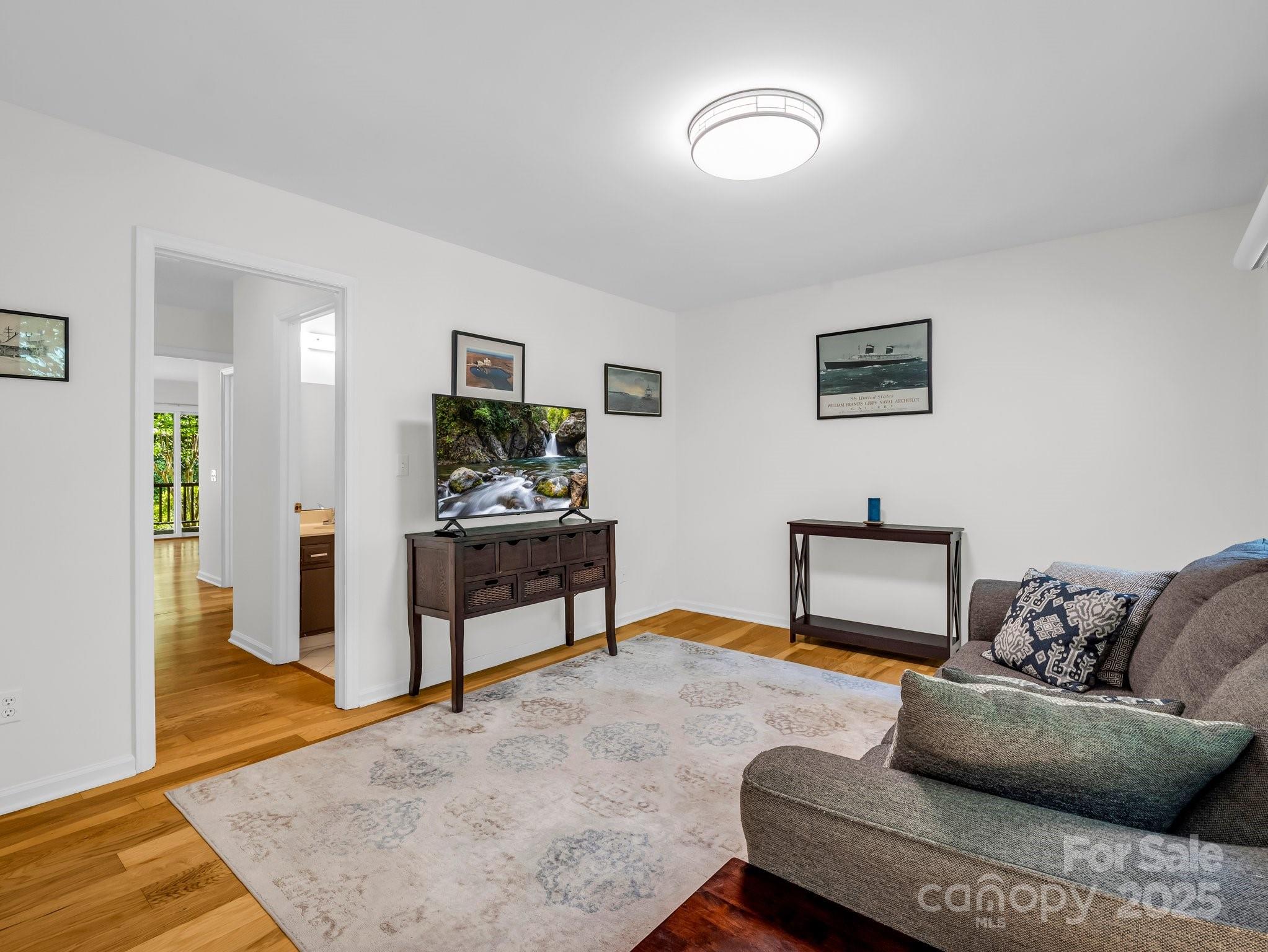8 Hunting Country Trail Tryon, NC 28782 - Photo 16 of 37 a living room with furniture and wooden floor
