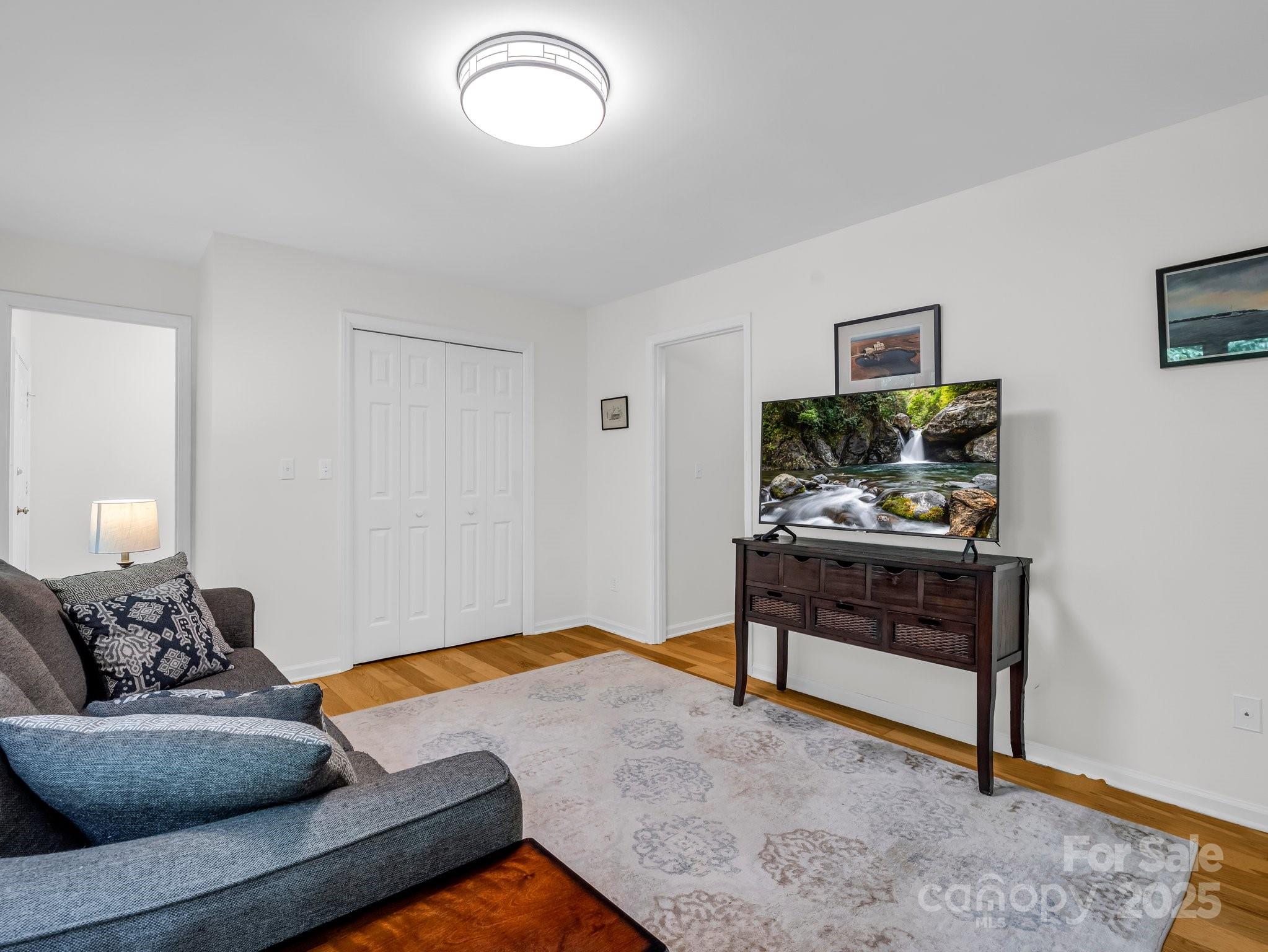 8 Hunting Country Trail Tryon, NC 28782 - Photo 18 of 37 a living room with furniture and a wooden floor