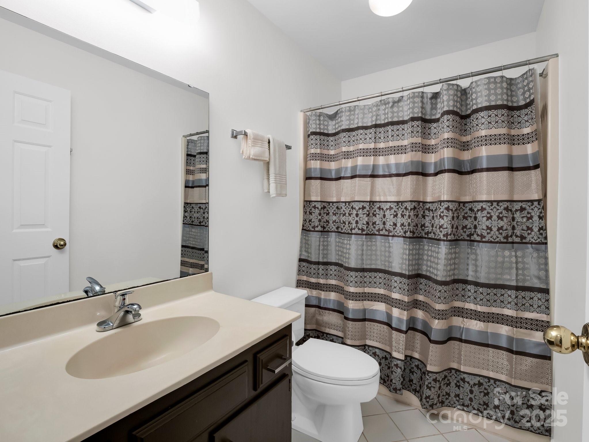 8 Hunting Country Trail Tryon, NC 28782 - Photo 19 of 37 a bathroom with a sink toilet and shower