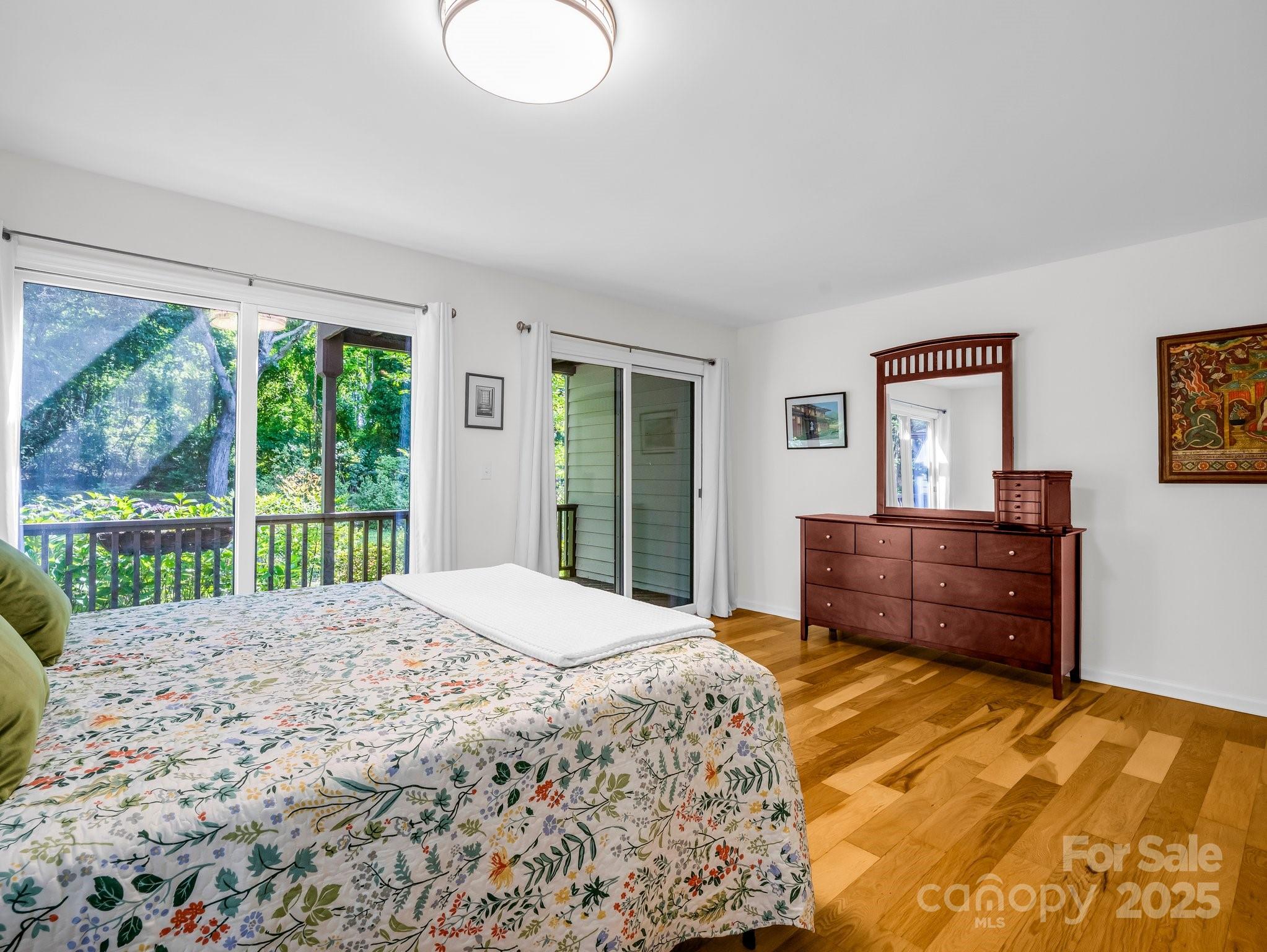 8 Hunting Country Trail Tryon, NC 28782 - Photo 22 of 37 a bedroom with a bed and a window