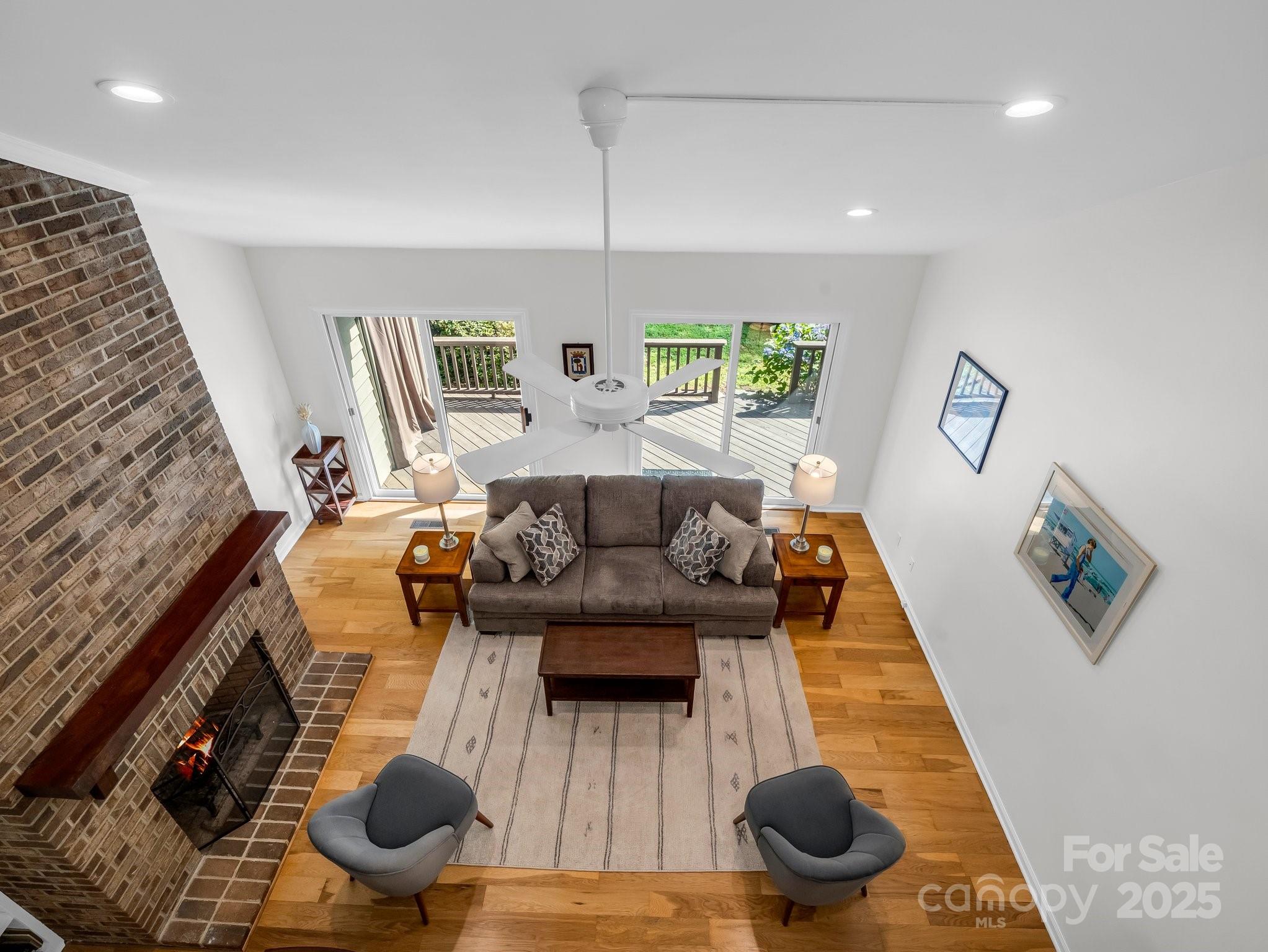 8 Hunting Country Trail Tryon, NC 28782 - Photo 24 of 37 a living room with furniture and a wooden floor