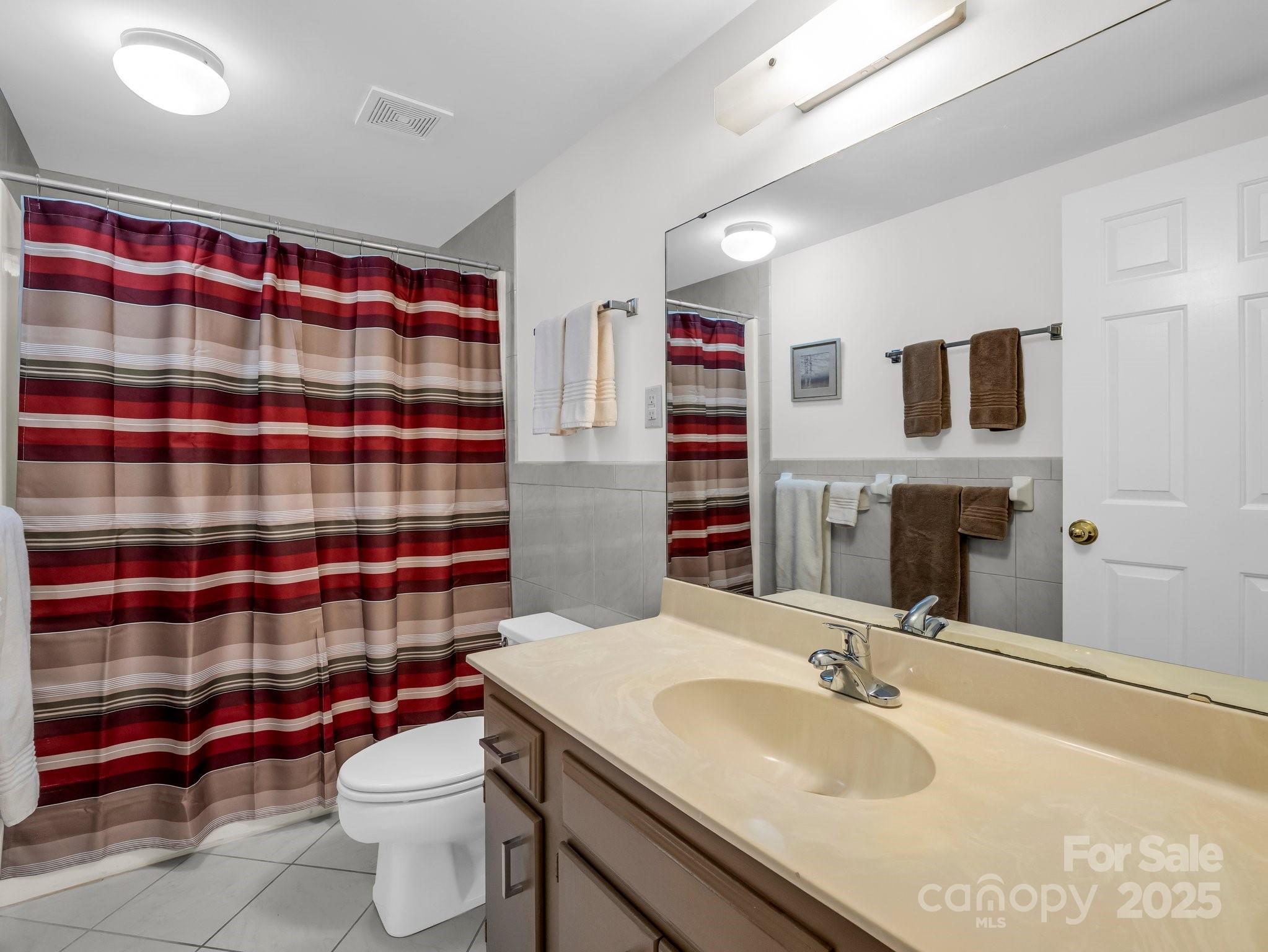 8 Hunting Country Trail Tryon, NC 28782 - Photo 28 of 37 a bathroom with a sink toilet and shower