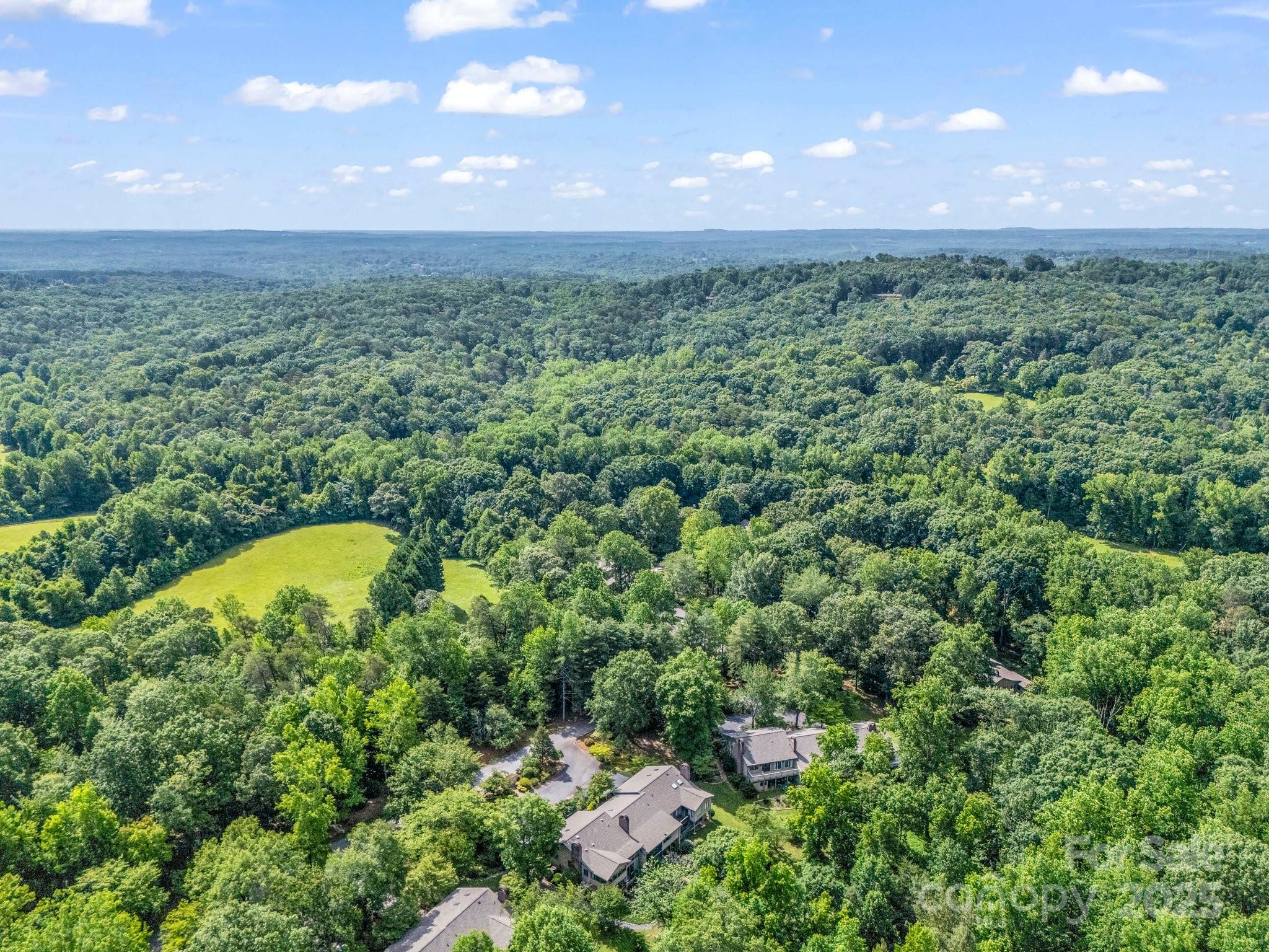 8 Hunting Country Trail Tryon, NC 28782 - Photo 36 of 37 a view of a outdoor space with a swimming pool and valleys in the background