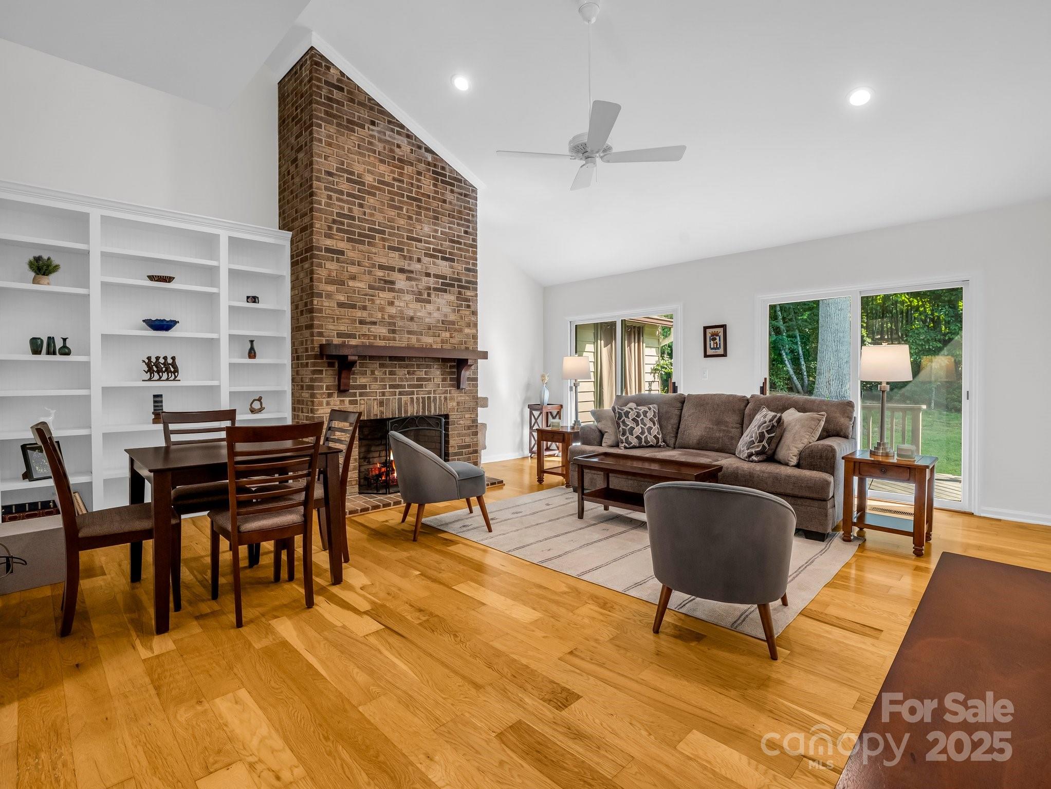 8 Hunting Country Trail Tryon, NC 28782 - Photo 4 of 37 a living room with furniture a fireplace and a table