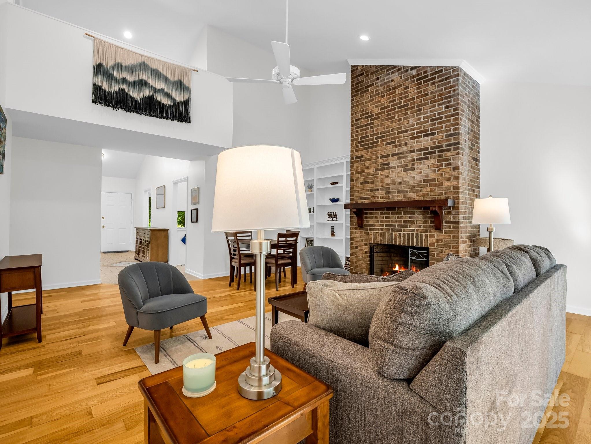 8 Hunting Country Trail Tryon, NC 28782 - Photo 5 of 37 a living room with furniture a fireplace and a flat screen tv