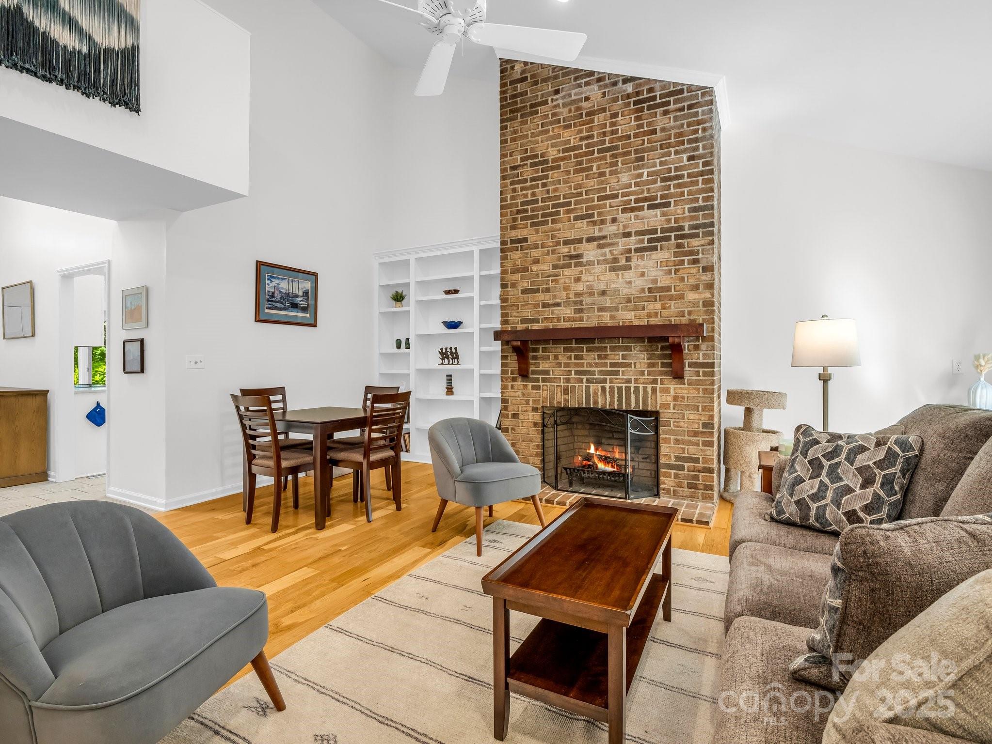 8 Hunting Country Trail Tryon, NC 28782 - Photo 6 of 37 a living room with furniture a fireplace and a table