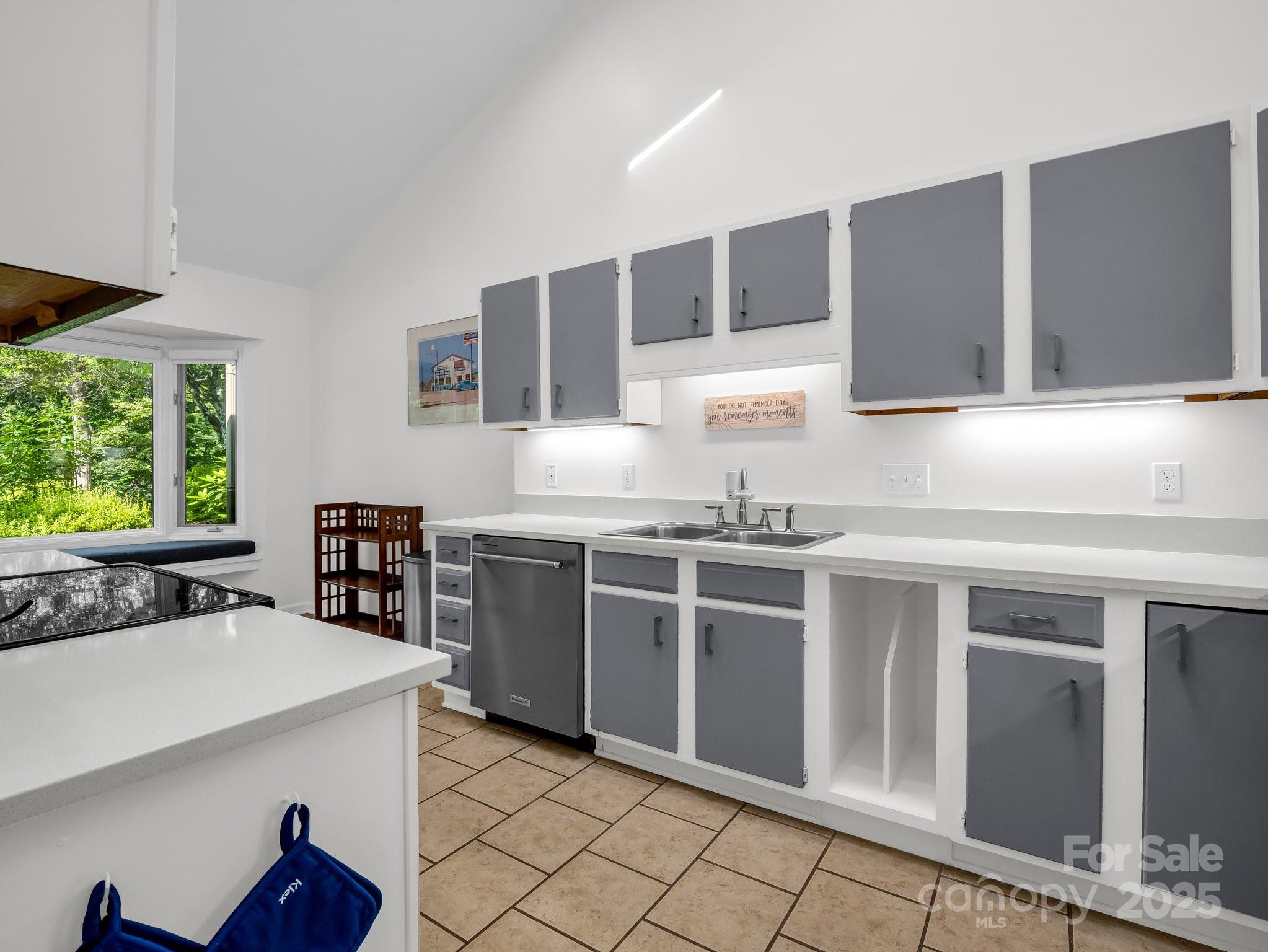 8 Hunting Country Trail Tryon, NC 28782 - Photo 10 of 37 a kitchen with stainless steel appliances granite countertop a stove a sink and a microwave