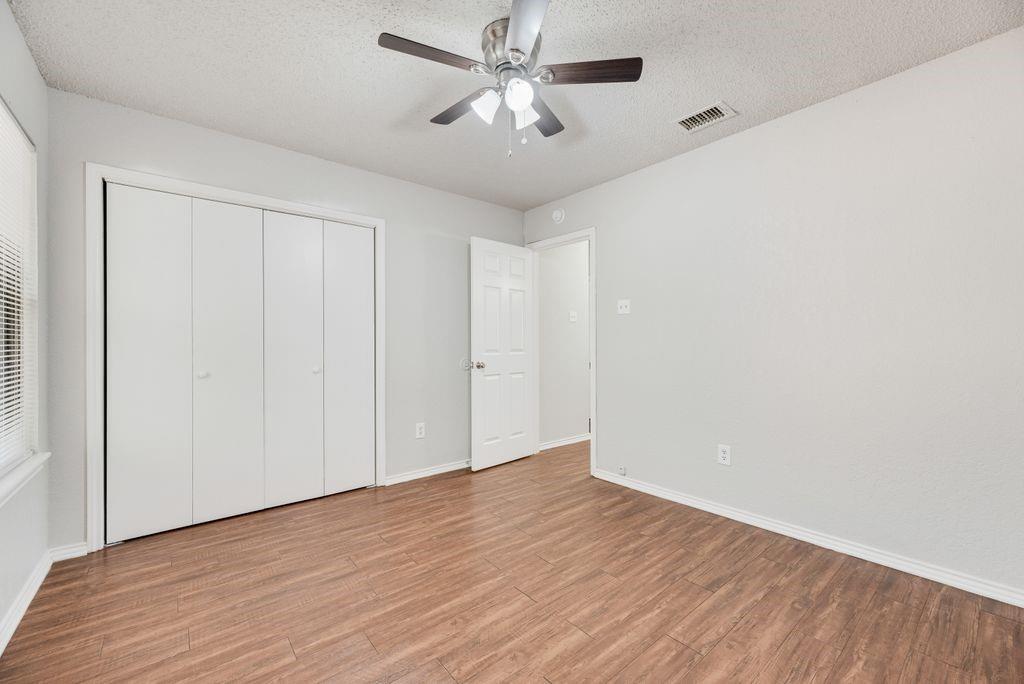 648 South Rogers Road, Unit 648 Irving, TX 75060 - Photo 11 of 20 wooden floor in an empty room