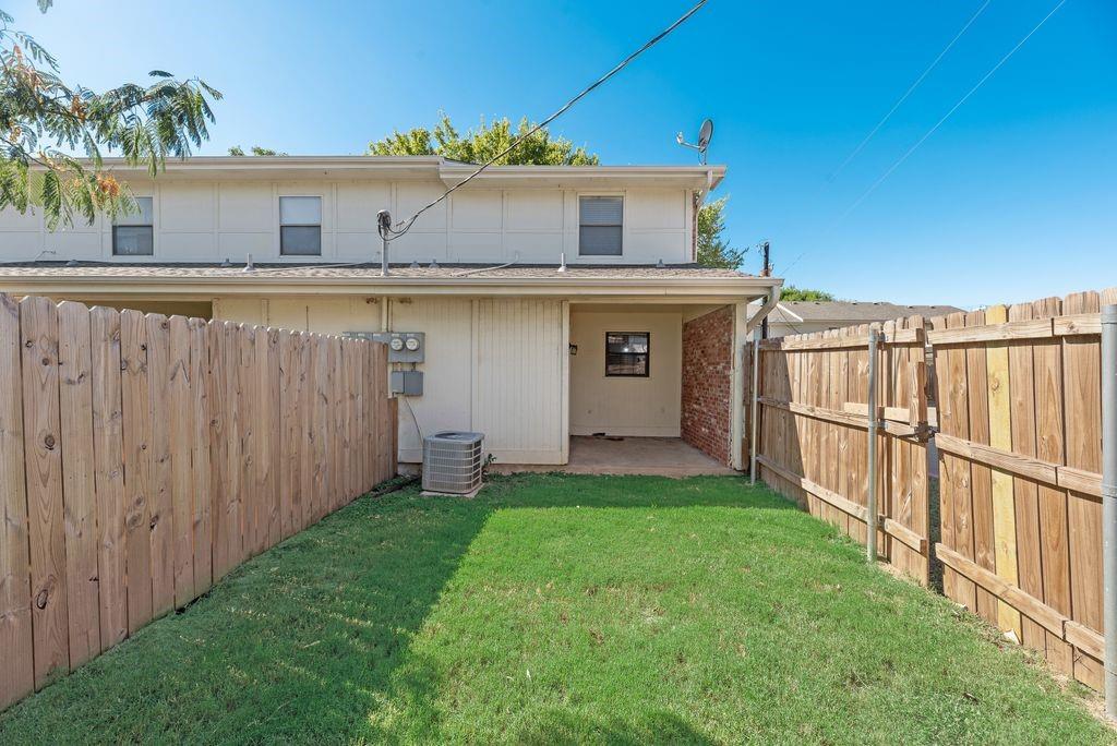 648 South Rogers Road, Unit 648 Irving, TX 75060 - Photo 19 of 20 a view of a house with a yard