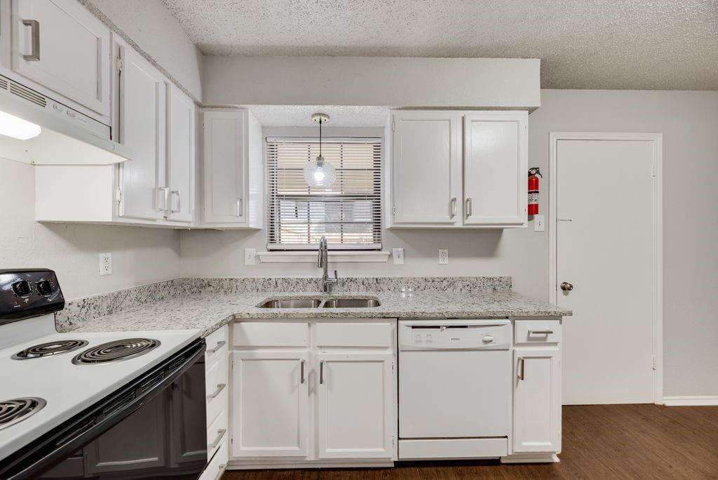 648 South Rogers Road, Unit 648 Irving, TX 75060 - Photo 10 of 20 a kitchen with stainless steel appliances granite countertop a sink stove and cabinets