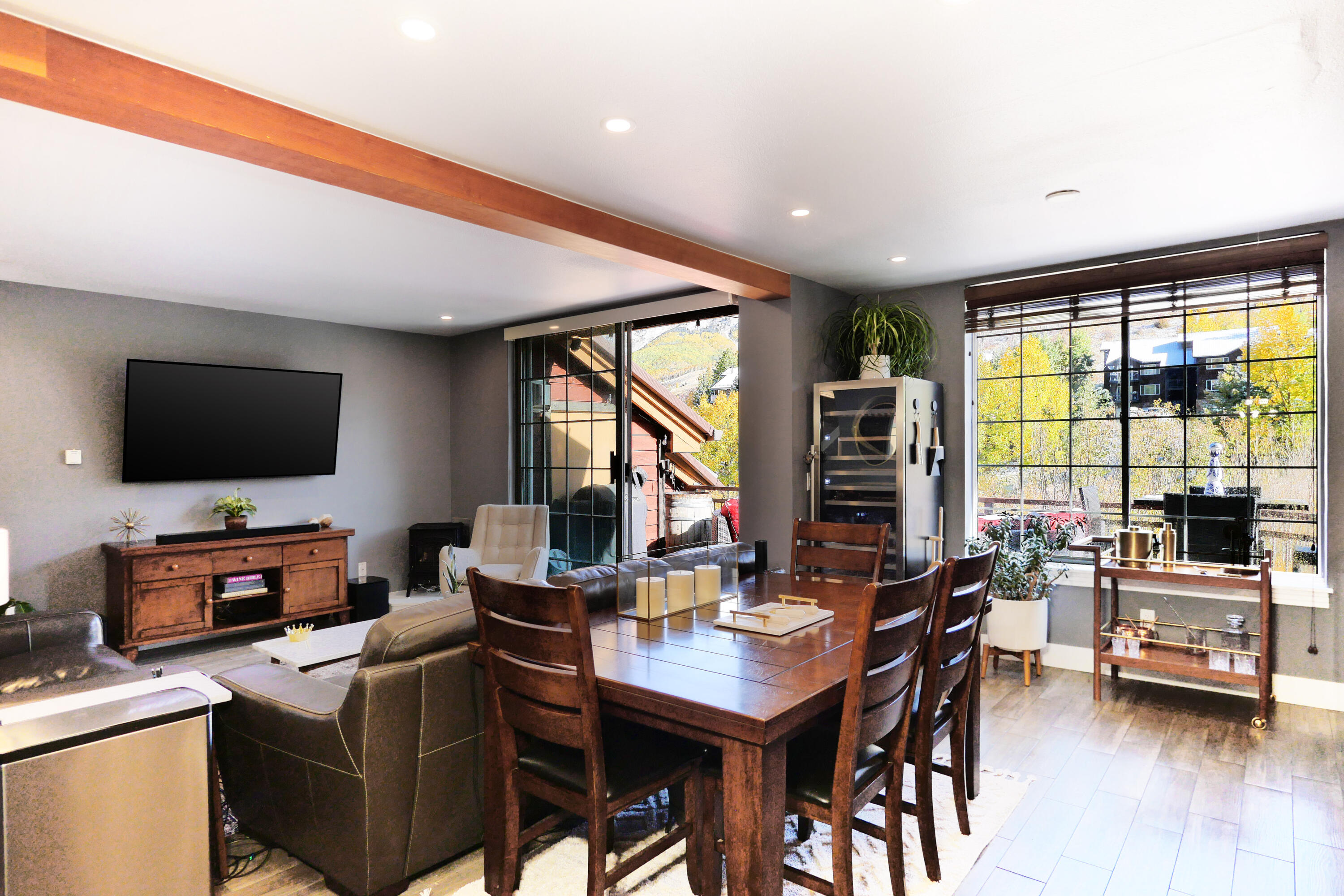 302 Adams Ranch Road, Unit 6 Mountain Village, CO 81435 - Photo 11 of 45 a view of a livingroom with furniture and a flat screen tv
