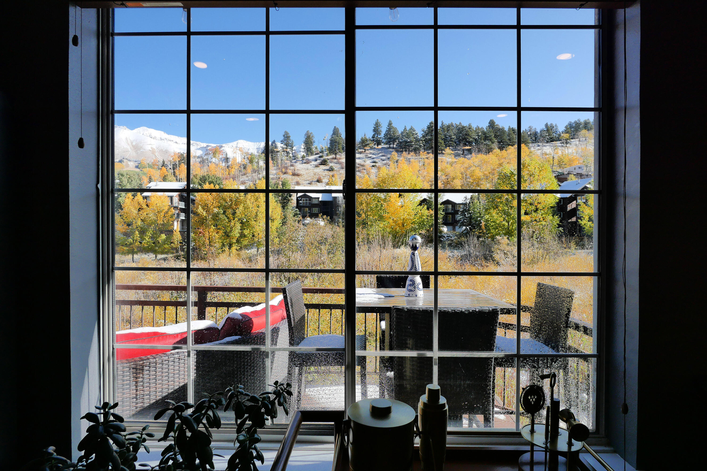 302 Adams Ranch Road, Unit 6 Mountain Village, CO 81435 - Photo 14 of 45 a room with wooden floor and windows