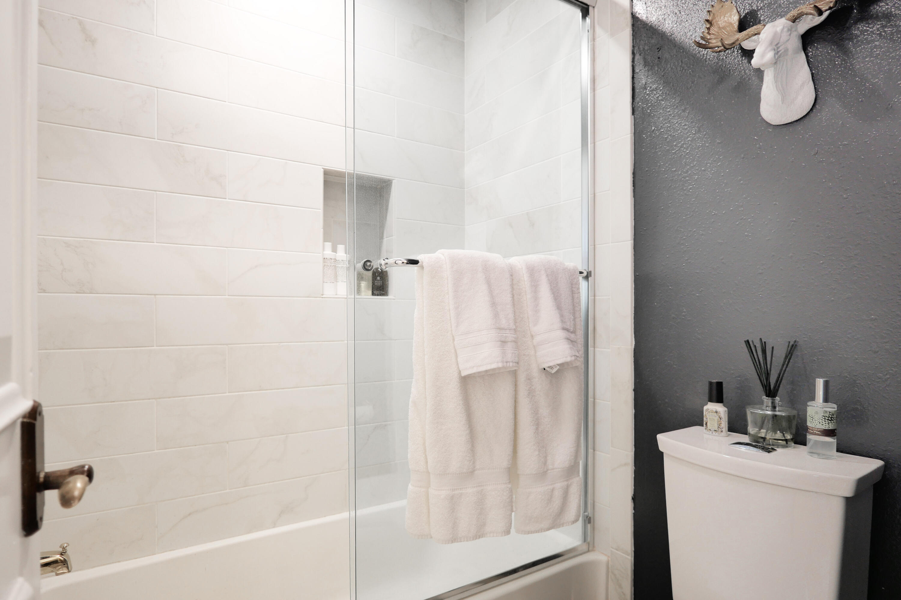 302 Adams Ranch Road, Unit 6 Mountain Village, CO 81435 - Photo 20 of 45 a bathroom with a granite countertop sink a toilet and shower