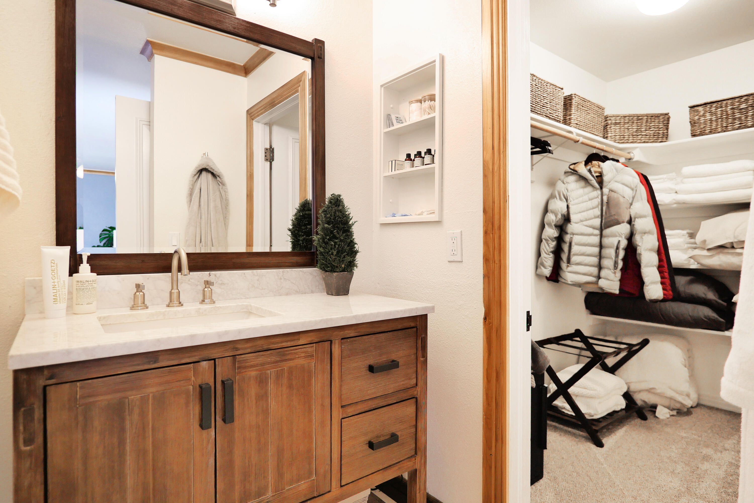 302 Adams Ranch Road, Unit 6 Mountain Village, CO 81435 - Photo 21 of 45 a bathroom with a sink vanity and a mirror