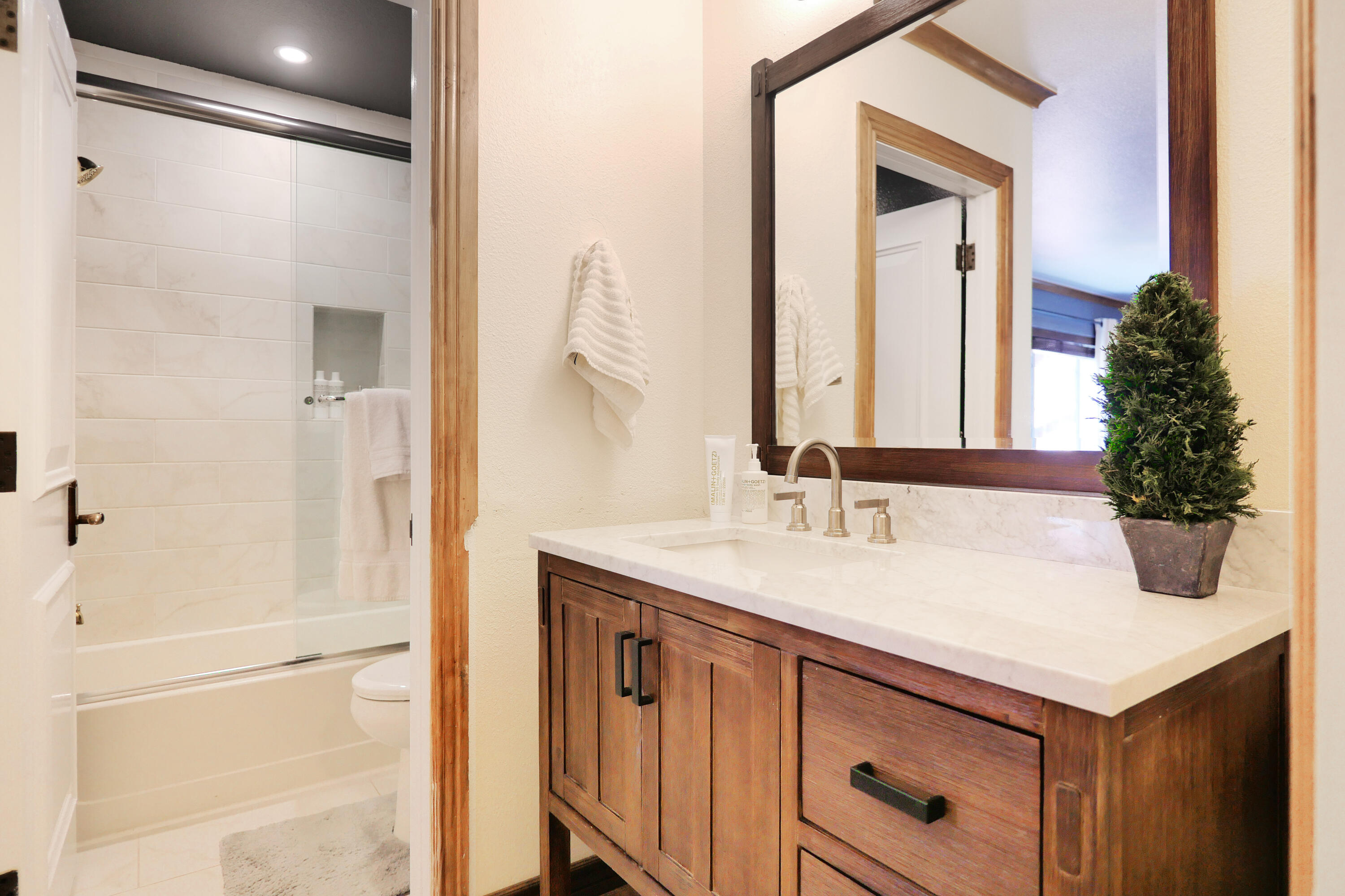 302 Adams Ranch Road, Unit 6 Mountain Village, CO 81435 - Photo 23 of 45 a bathroom with a sink and a mirror