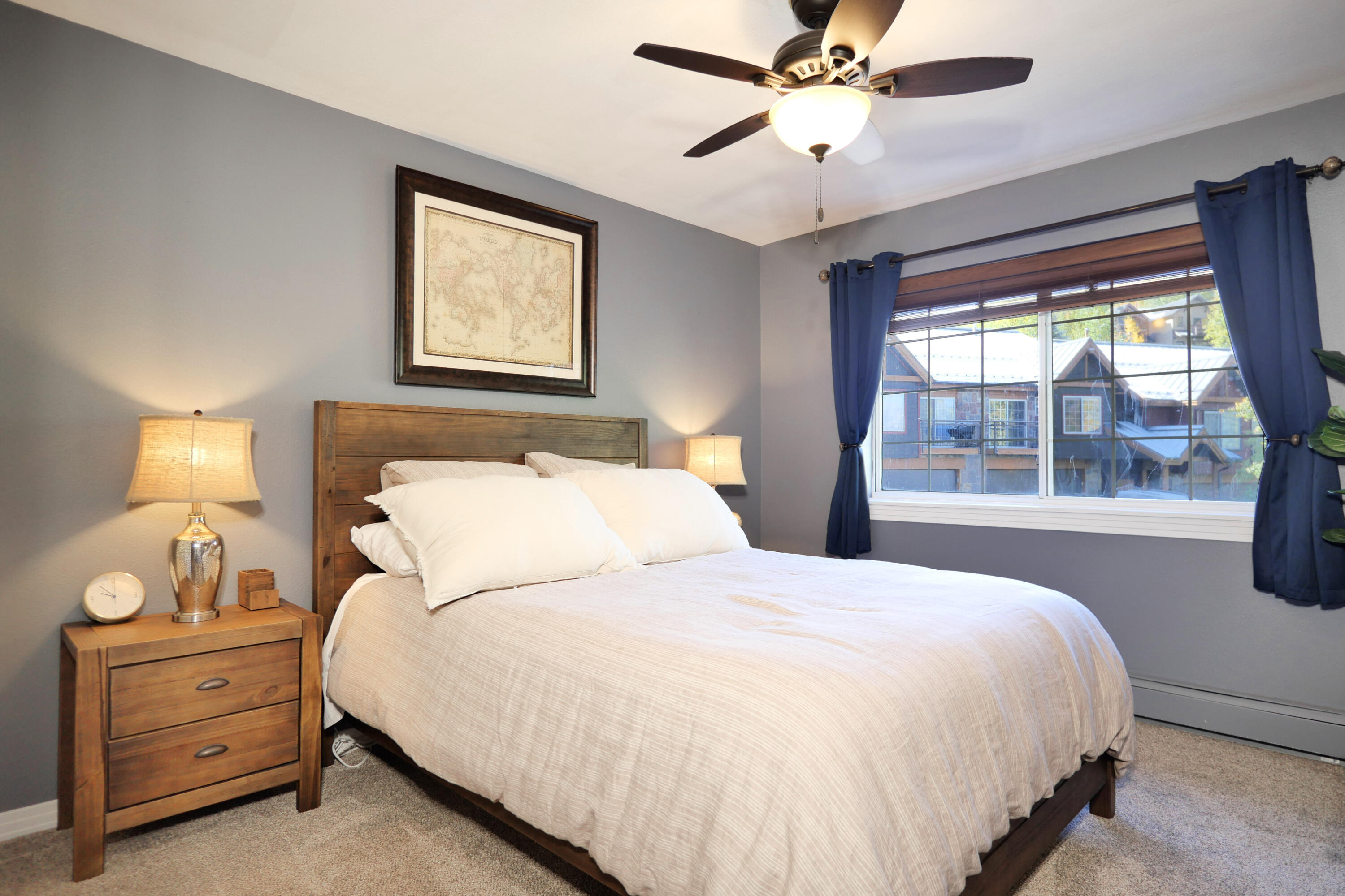 302 Adams Ranch Road, Unit 6 Mountain Village, CO 81435 - Photo 26 of 45 a bedroom with bed and window