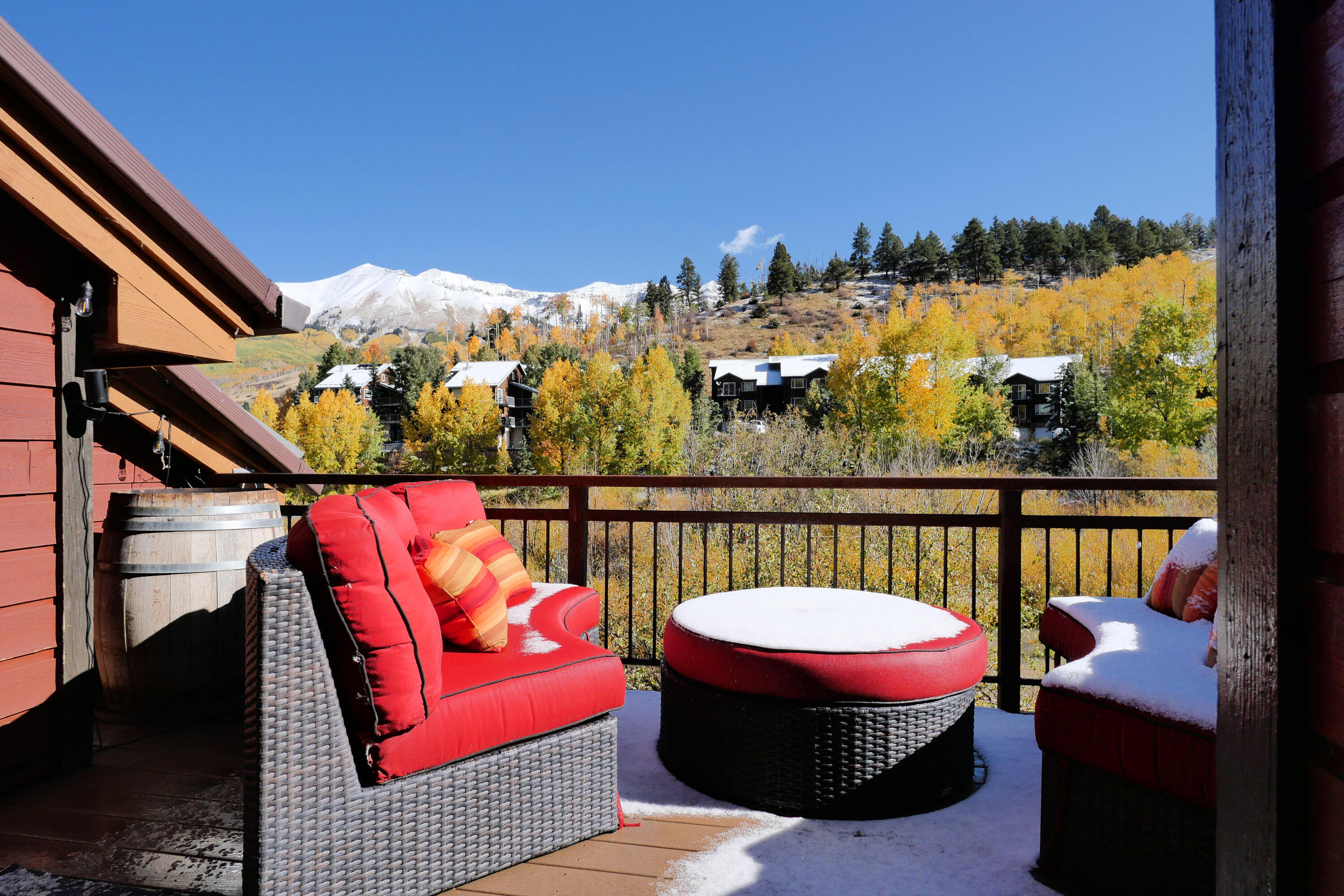 302 Adams Ranch Road, Unit 6 Mountain Village, CO 81435 - Photo 37 of 45 a view of a balcony with couches and wooden floor
