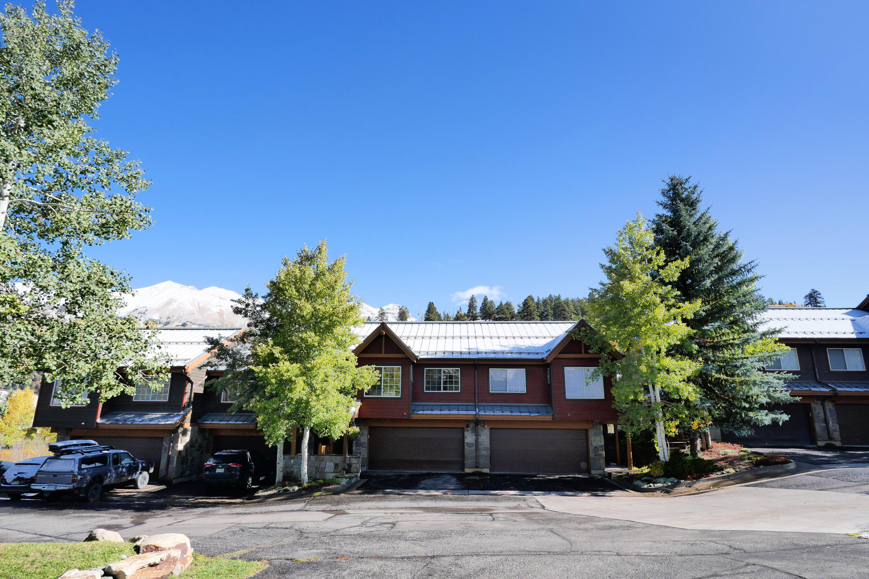 302 Adams Ranch Road, Unit 6 Mountain Village, CO 81435 - Photo 38 of 45 a front view of a house with a yard