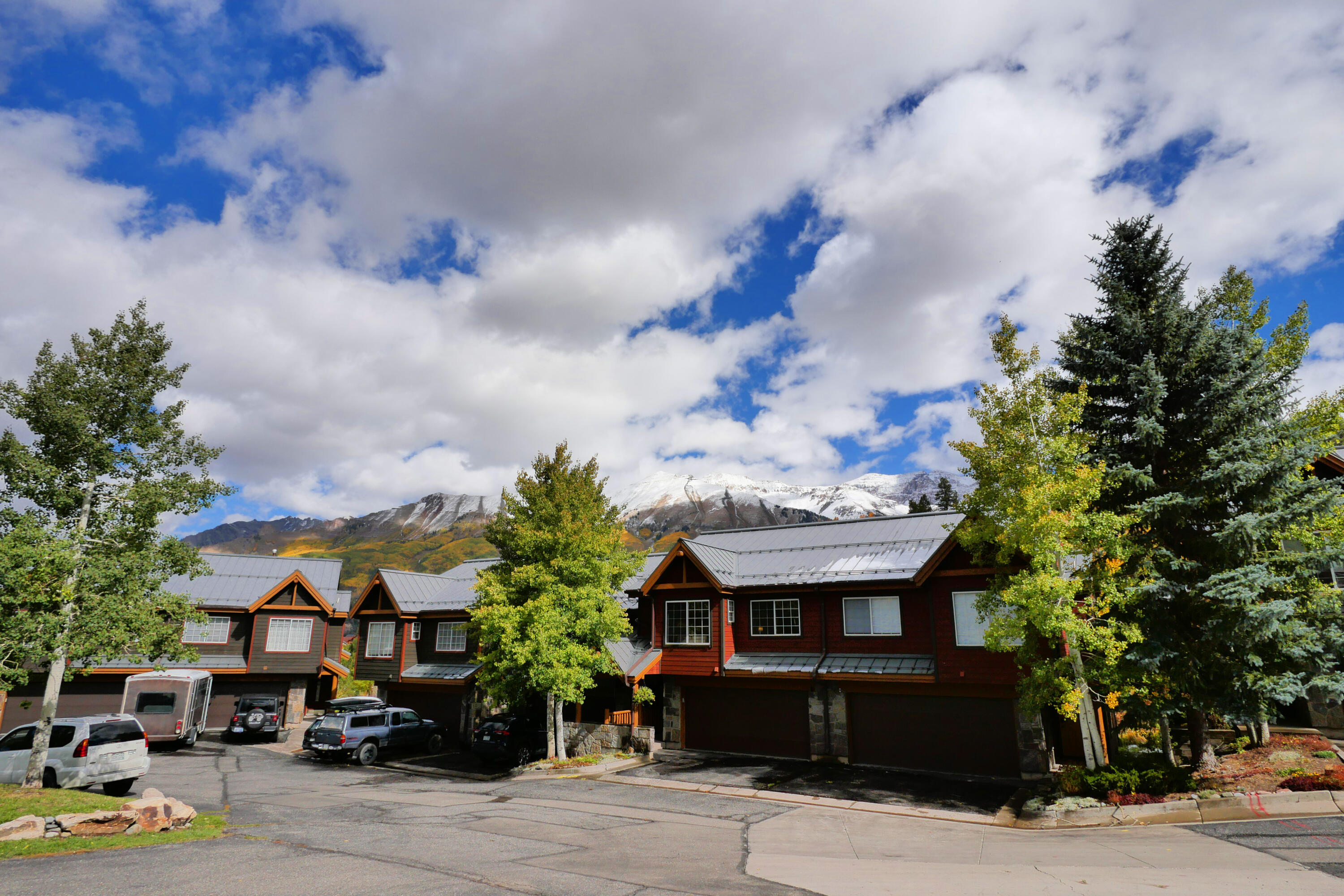302 Adams Ranch Road, Unit 6 Mountain Village, CO 81435 - Photo 43 of 45 a front view of a house with a garden