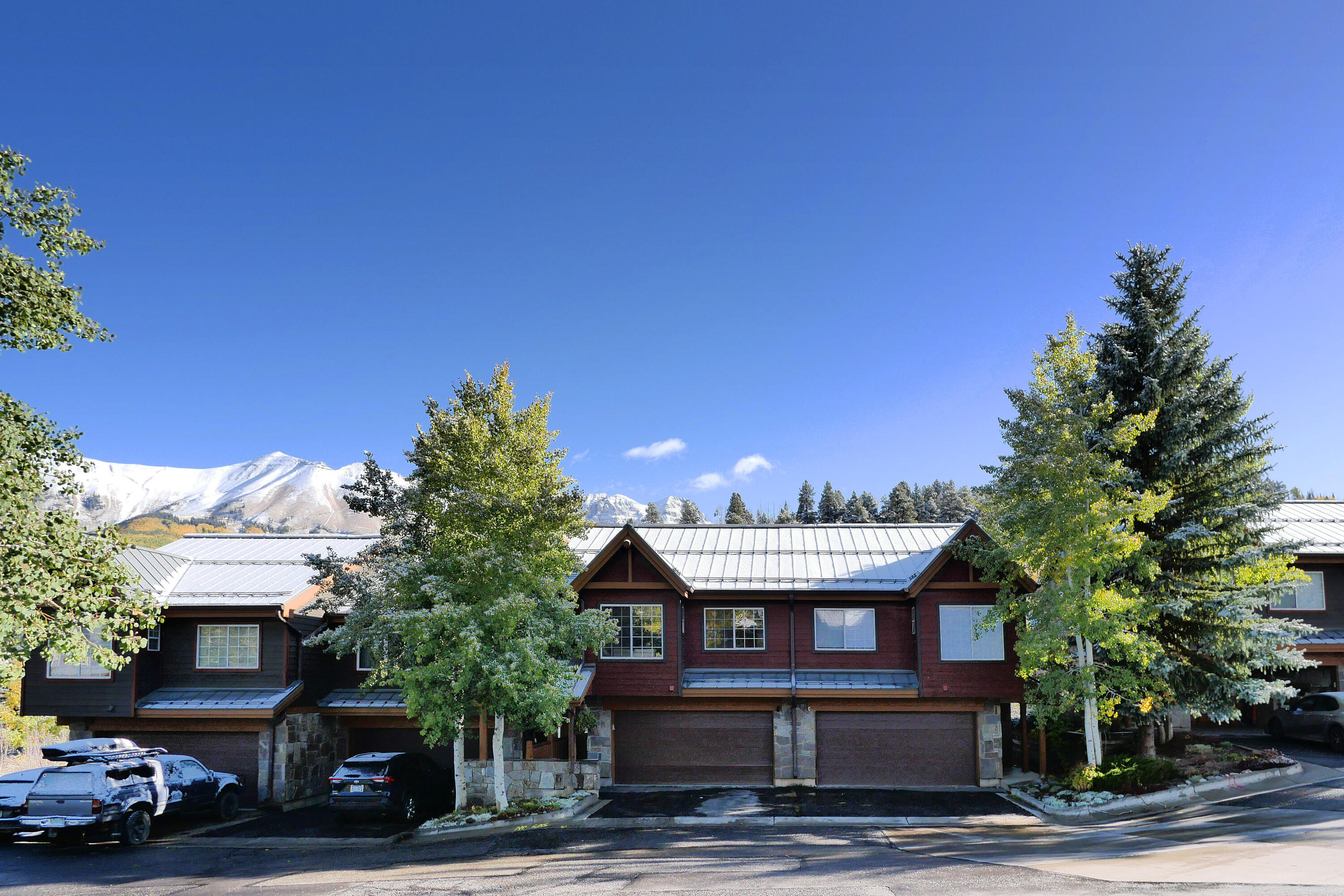302 Adams Ranch Road, Unit 6 Mountain Village, CO 81435 - Photo 6 of 45 a front view of a house with a yard