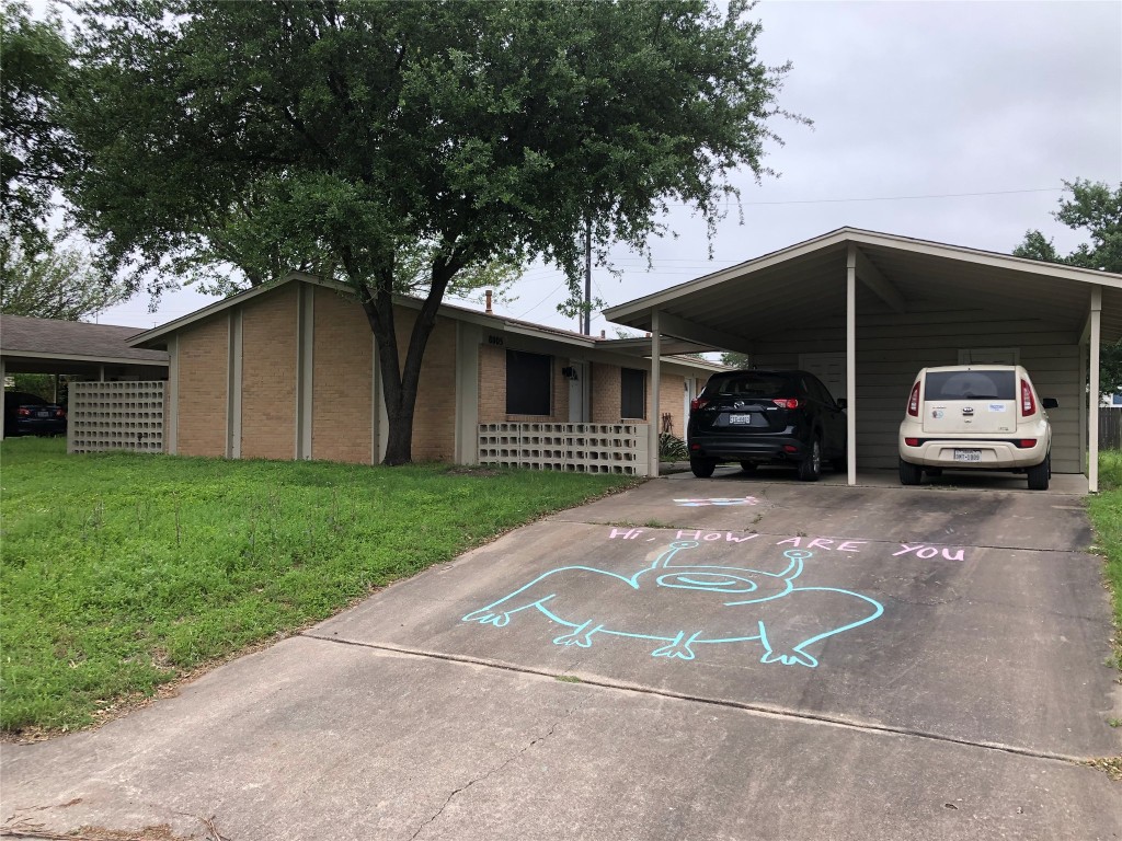 8005 Pinedale Cove, Unit B Austin, TX 78757 - Photo 22 of 22 a view of a car parked in front of a house