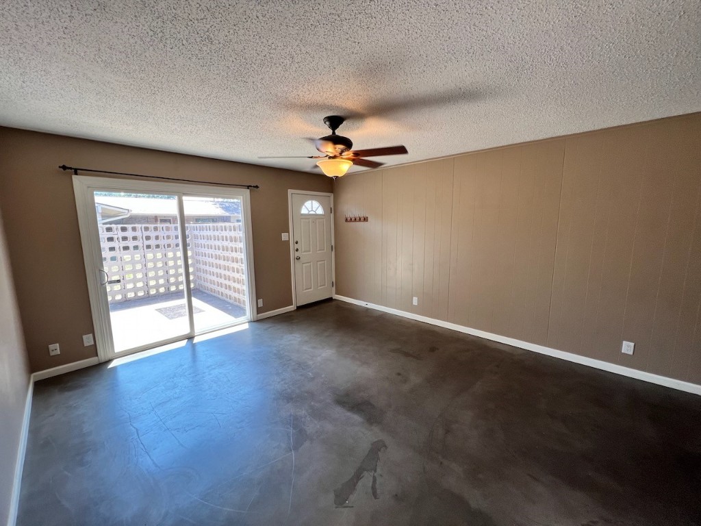 8005 Pinedale Cove, Unit B Austin, TX 78757 - Photo 6 of 22 an empty room with wooden floor and fan