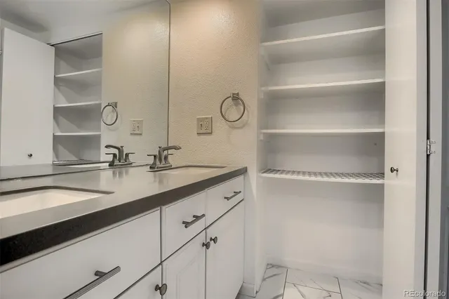 a bathroom with a toilet and bathtub