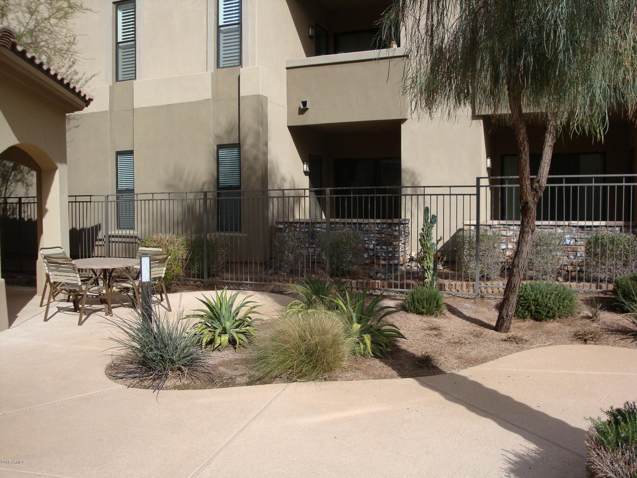 7027 North Scottsdale Road, Unit 131 Paradise Valley, AZ 85253 - Photo 21 of 30 Patio by the Community Pool